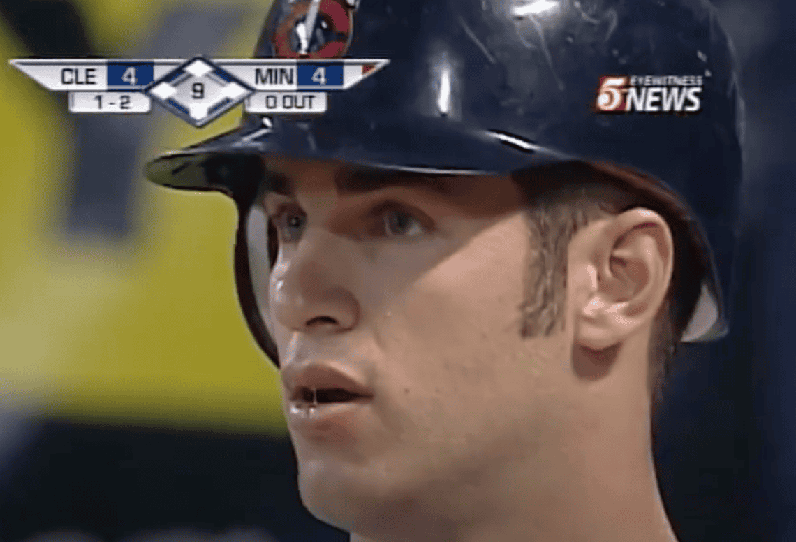 Image of Joe Mauer, a top hitting catcher, showcasing his batting skills in context.